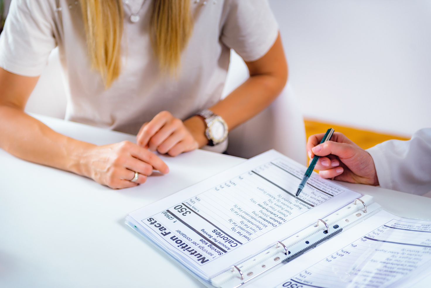 Nutritionist with female patient